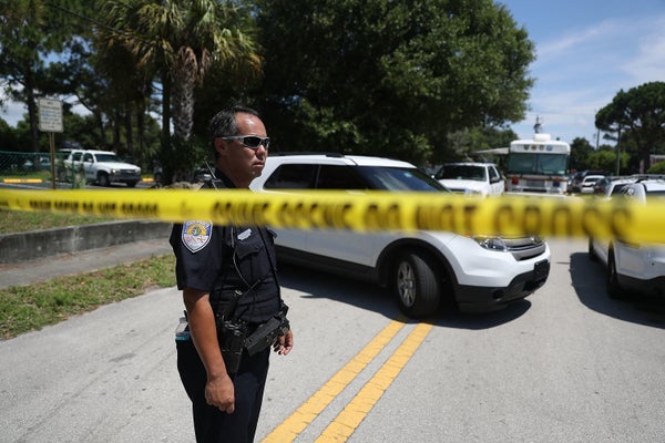 Police tape marks off the entrance to the apartment building where shooting suspect Omar Mateen is believed to have lived on 
