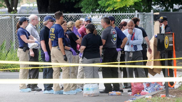 FBI agents seen outside of Pulse nightclub after a fatal shooting and hostage situation on June 12, 2016 in Orlando, Florida.
