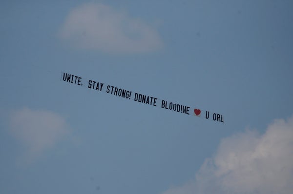A message towed by an airplane urges people to donate blood, after a mass shooting at a gay nightclub in Orlando, Florida, U.