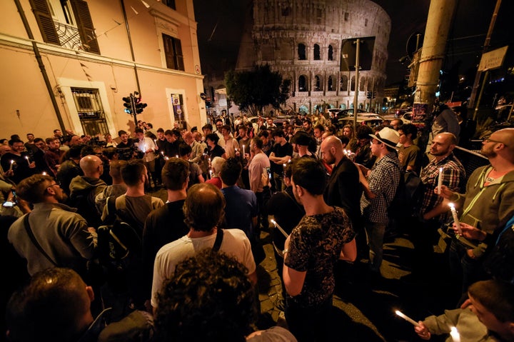 Outside the Colosseum in Rome, LGBT rights supporters hold candles in memory of the victims of the Orlando shooting.