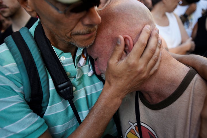 Todd Fernandez cries after a vigil outside The Stonewall Inn on Christopher Street.