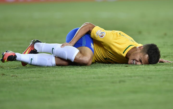 Brazil's Philippe Coutinho gestures on the ground during the Copa America Centenario football tournament match against Peru.