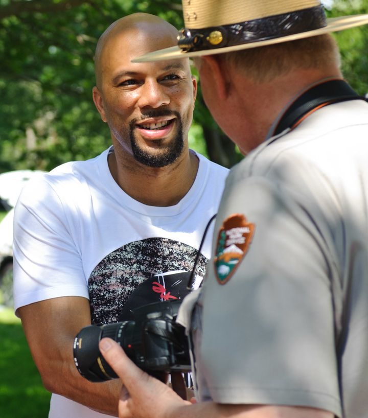 Common serves as Honorary Grand Marshal at the National Park Service Centennial Event at Washington Park on June 11, 2016 in Chicago.