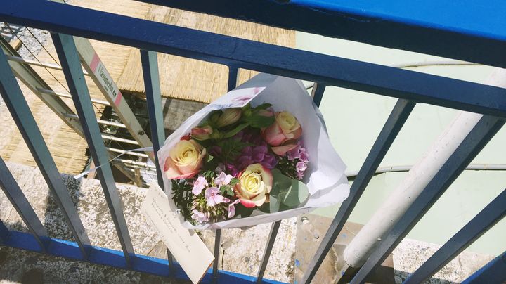 Flowers are left close to the scene where Rodgers died after a fall 