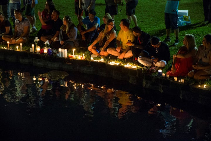 Mourners gather at Lake Eola in Orlando for a candle light vigil for the victims of the terrorist massacre at the gay night club, Pulse, on June 12, 2016.