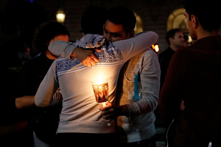 Two San Francisco men hug at a vigil for the victim's of the Orlando shooting. 