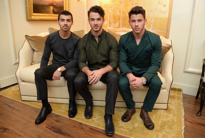 Joe, Kevin and Nick Jonas attend Mercedes-Benz Fashion Week in 2013.