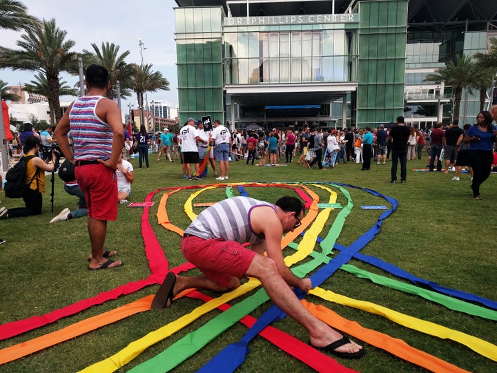 Thousands converged at the Dr. Phillips Center for the Performing Arts in Orlando to remember those lost in the mass shooting on Sunday. Speakers declared, "We are stronger than fear. Love will conquer hate. Orlando united!"