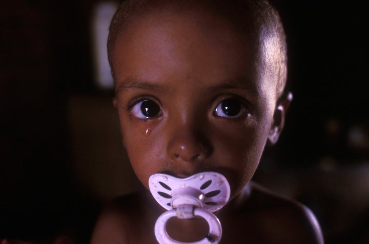 Infant malnutrition, portrait of two-years old half-breed boy crying and looking directly at camera, Pernambuco State, Northe