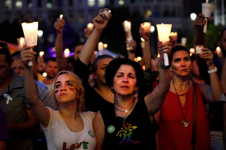 Madeline Lago, 15, and her mother Carmen Lago (center) were among the thousands who gathered for a memorial rally in downtown Orlando on June 13 to honor those killed and wounded in the Pulse nightclub attack.