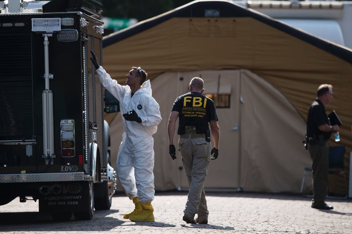 Members of the FBI and other investigators work in the area around Pulse nightclub on June 13 in Orlando, Florida.