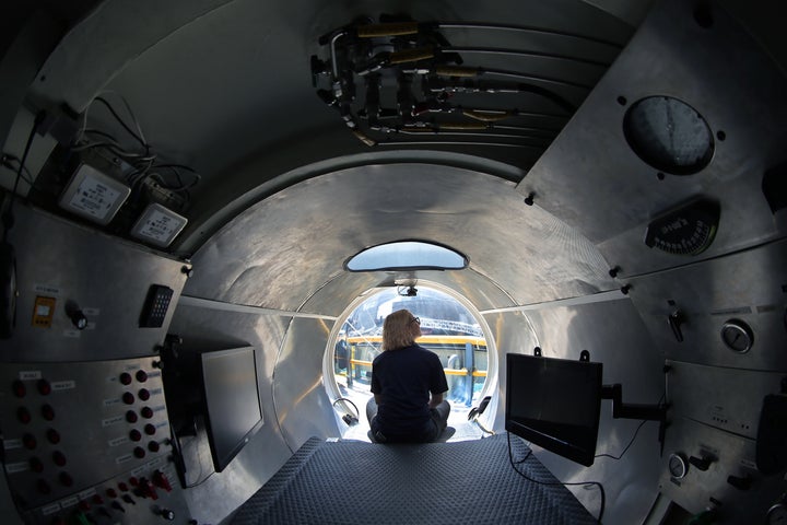 Submarine pilot-in-training Isabel Johnson sits at the bow of the Cyclops 1, a five-person sub used to capture detailed sonar images of the Andrea Doria, which sank 60 years ago this summer.