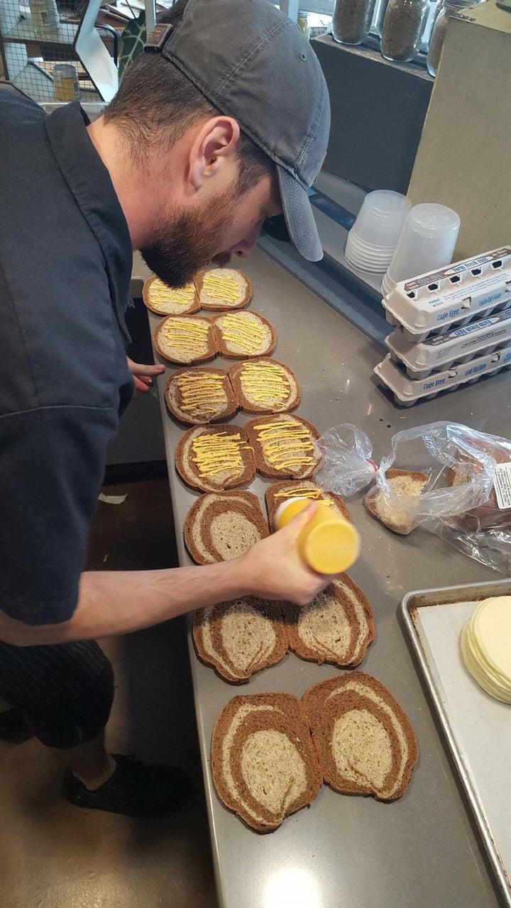 An employee at Swine & Sons prepared food donations. 