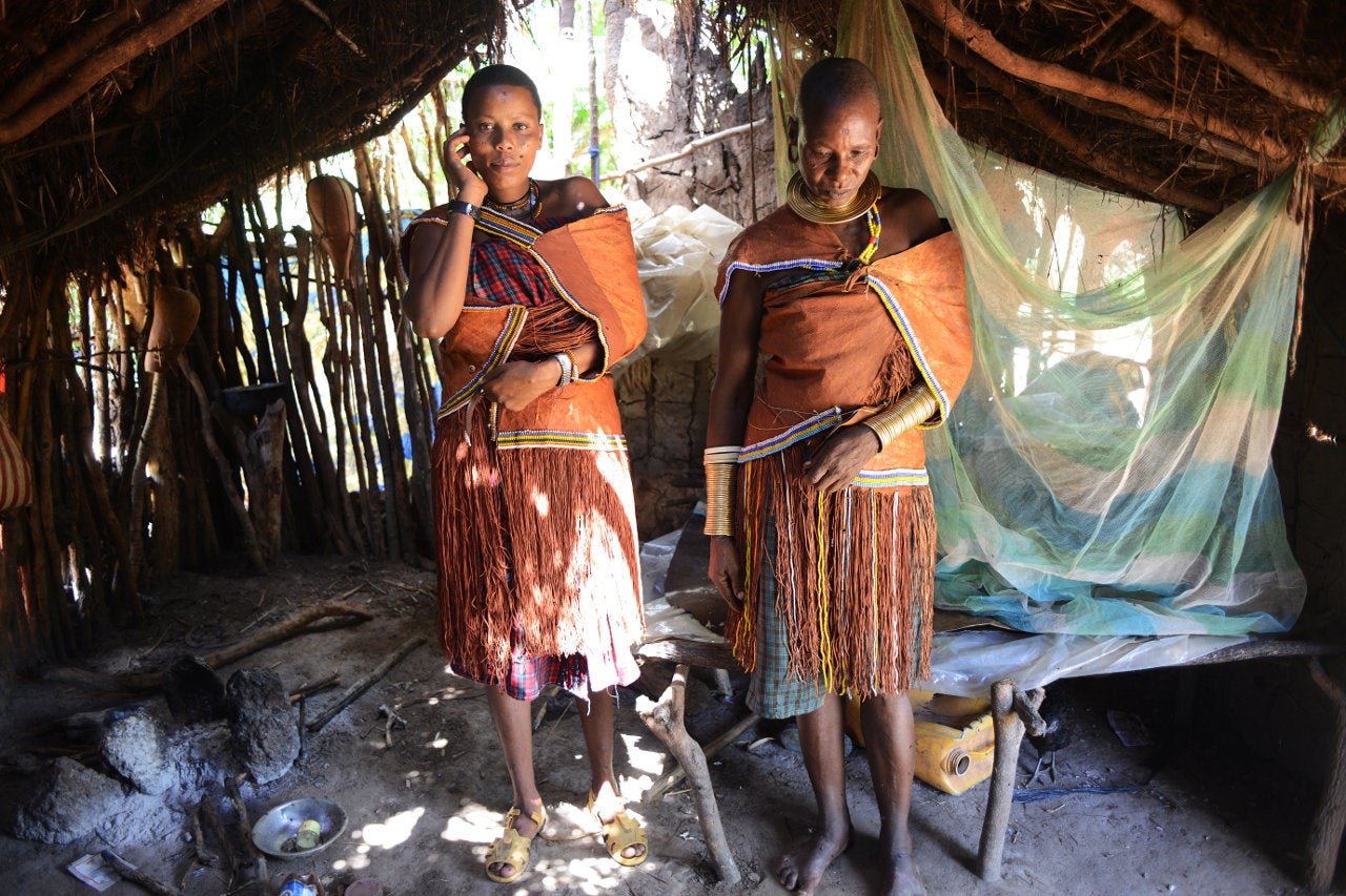 Udenda Gidaghorjod, 20, and her mother, Wembida, 40, in traditional Barabaig dress at home.