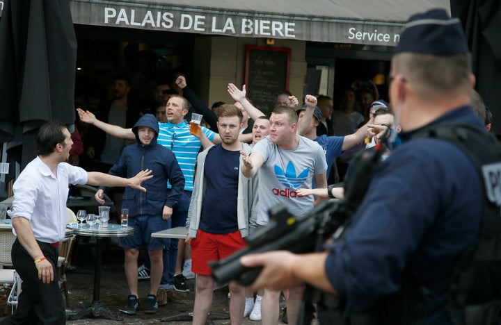<strong>England and Wales fans react to their Russian taunters as police and restaurant staff try and intervene </strong>