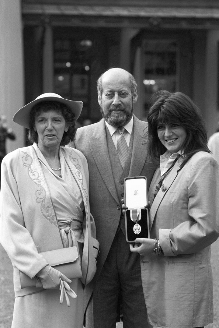 Sir Clement Freud with his wife Jill (left) and daughter Emma after receiving his knighthood at Buckingham Palace in 1987.