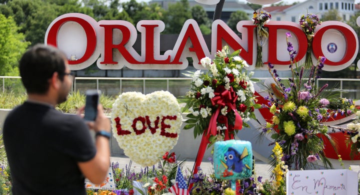 Visitors pay their respects on Tuesday to the victims of the Pulse shooting at a makeshift memorial at Orlando Regional Medical Center, a few blocks from the nightclub.