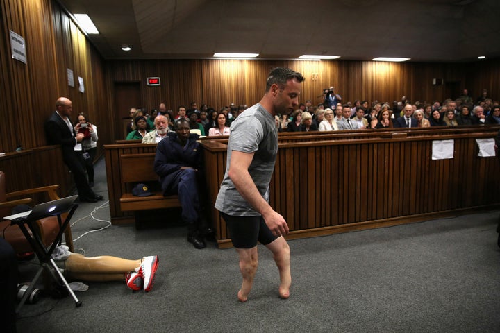 Paralympic gold medalist Oscar Pistorius walks across the courtroom without his prosthetic legs during the third day of the resentencing hearing for the 2013 murder of his girlfriend Reeva Steenkamp, at Pretoria High Court, South Africa June 15, 2016.