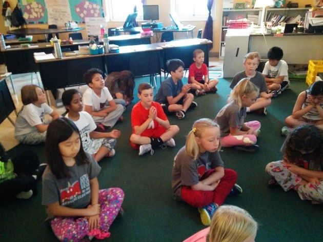 Ms. Yoder's third graders turn inwards to focus on their breathing during meditation