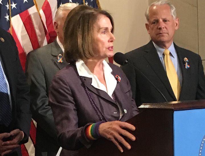 House Minority Leader Nancy Pelosi (D-Calif.) wears a rainbow wristband and ribbon while addressing the press about the Orlando shooting.