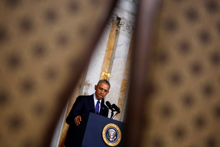 U.S. President Barack Obama pauses as he delivers a statement after a meeting with his national security team at the Treasury