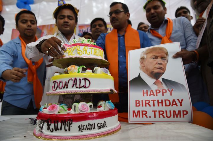 Indian conservative Hindu activists hold a birthday celebration for Donald Trump in New Delhi on Tuesday.