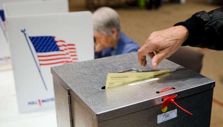 A voter casts a provisional ballot in the primary election on March 15, 2016, in Westerville, Ohio.