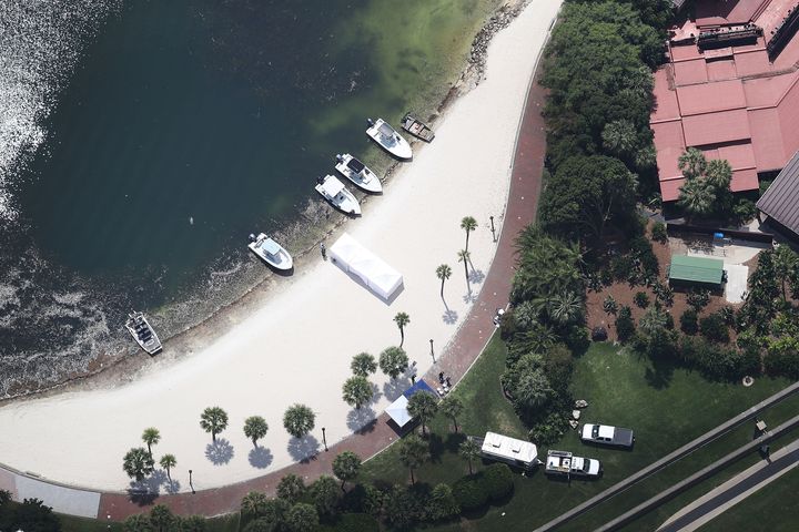 Search and rescue boats on a beach near the Walt Disney World's Grand Floridian resort hotel where a 2-year-old boy was taken by an alligator.