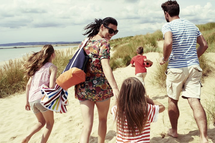 Family day out at the beach Brand New Images via Getty Images