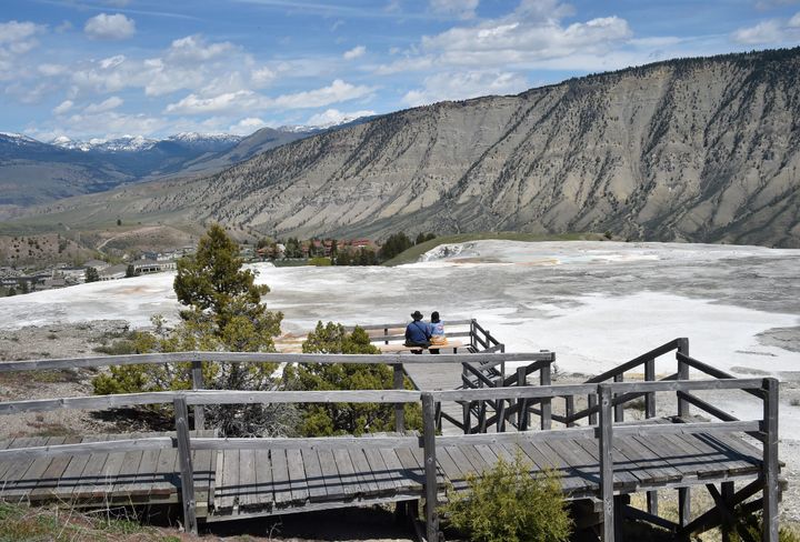 A tourist was fined $1,000 after Yellowstone National Park officials say he walked off a boardwalk around Mammoth Hot Springs, pictured.
