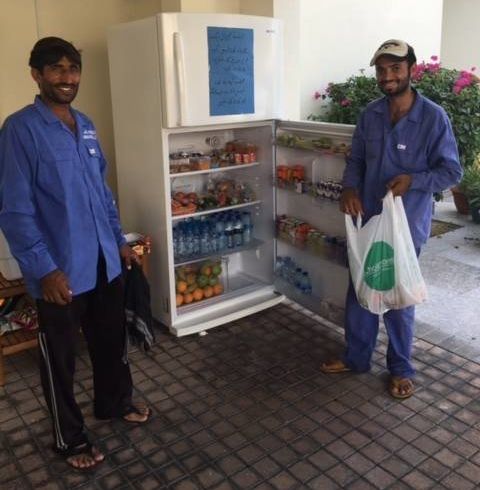 Local workers welcome the Sharing Fridge initiative, which allows them to grab food and beverages to break their fast during Ramadan.