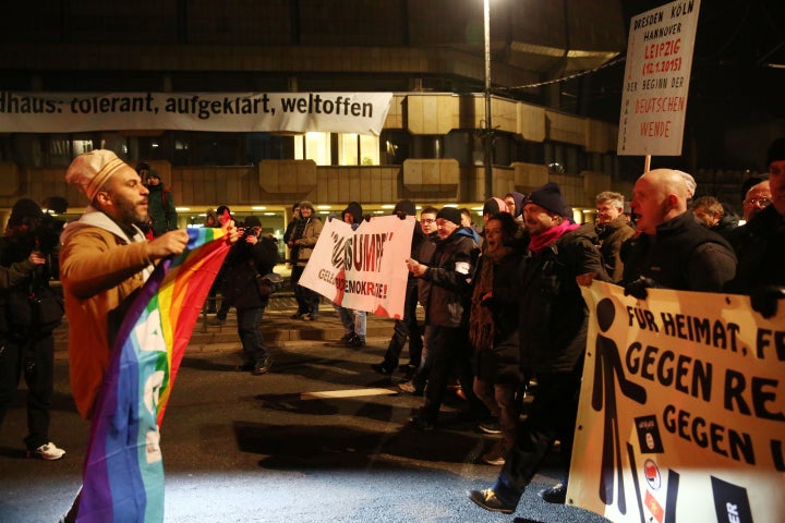 A group of people hold banners to protest racism and Islamophobia as the another demonstrator group, led by LEGIDA, Leipzig's local copycat of far right movement PEGIDA, gather on a demonstration in Leipzig, Germany on January 21, 2015.