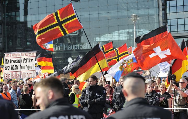 Far right-wing demonstrators gather in front of Hauptbahnhof railway station under the banner "We for Berlin - We for Germany" to protest against German Chancellor Angela Merkel's refugee policy.