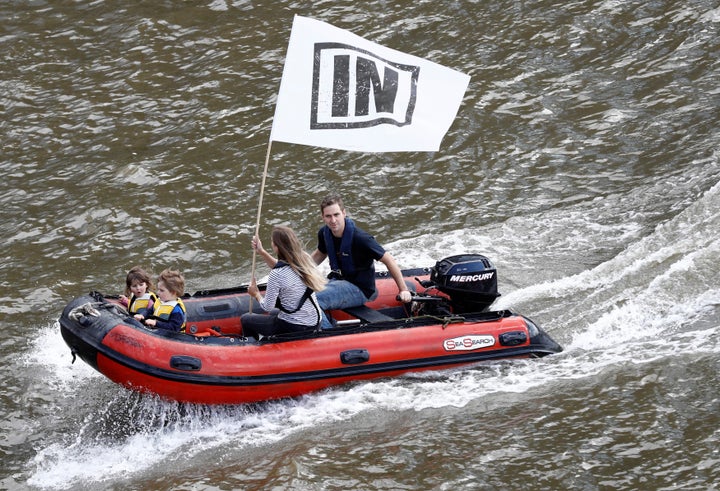 Cox's husband, Brendan Cox, and their two daughters ride an inflatable dinghy as they take part in a counter-demonstration to support the Remain campaign on the river Thames in London on Wednesday.