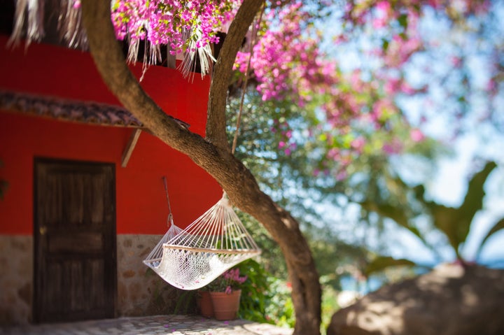 Casa de los Suenos is nestled in jungle gardens overlooking a lagoon.