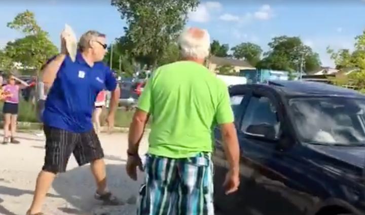 1-2-3! A man is seen breaking into a parked BMW to rescue a small dog after its owners locked it inside.