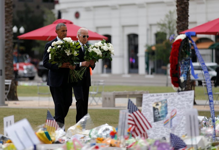 President Barack Obama and Vice President Joe Biden place flowers at a makeshift memorial for shooting victims of the massacre at a gay nightclub in Orlando, Florida.