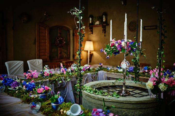 The tables featured moss and cascading garden party florals. 