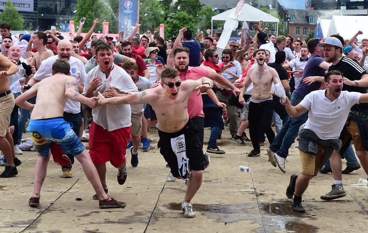 <strong>England fans in Lille celebrate as England score a late winning goal</strong>