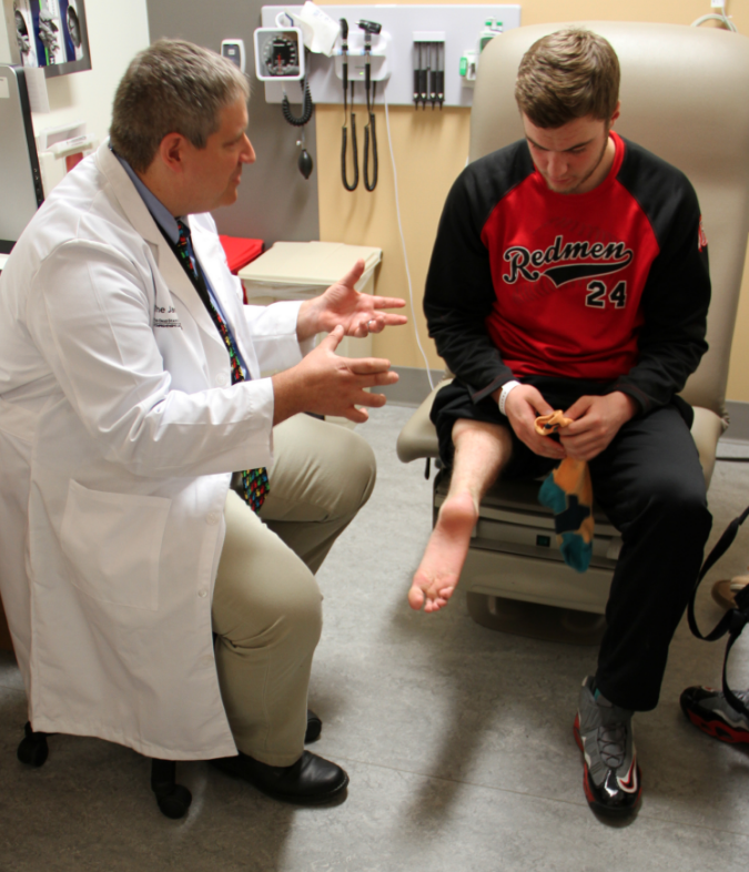 Dr. Joel Mayerson talks with Dugan Smith, a survivor of bone cancer known as osteosarcoma, at The Ohio State University Comprehensive Cancer Center - Arthur G. James Cancer Hospital and Richard J. Solove Institute