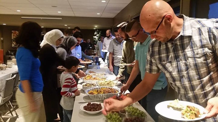 Muslims break their fast at a Ramadan iftar hosted by the Rockyview Alliance Church in Calgary, Alberta.