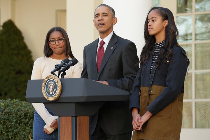 President Barack Obama, pictured here with his daughters, has pushed for policies like paid parental leave. 