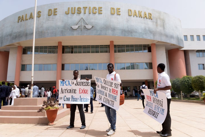 Demonstrators outside Dakar Courthouse ahead of the sentencing of former Chadian dictator Hissene Habre on May 30, 2016