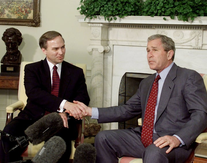 U.S. President George W. Bush poses with new U.S. Congressman Randy Forbes (R-VA) in the Oval Office of the White House in Wa