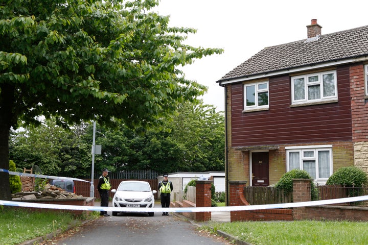 Police officers stand outside the home of Thomas Mair, the man charged with the murder of Labour MP Jo Cox.