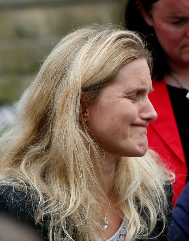 Kim Leadbeater, the sister of Labour MP Jo Cox, looks at floral tributes left in Birstall, West Yorkshire