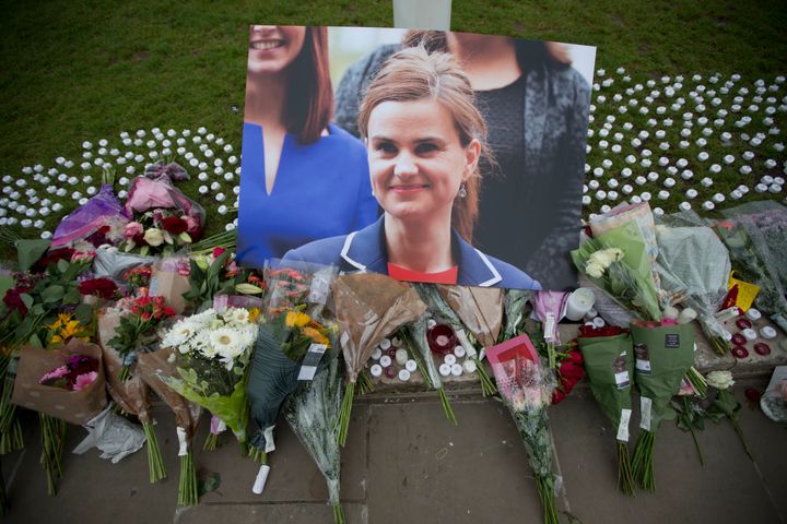 An image and floral tributes for Jo Cox on Parliament Square on Friday