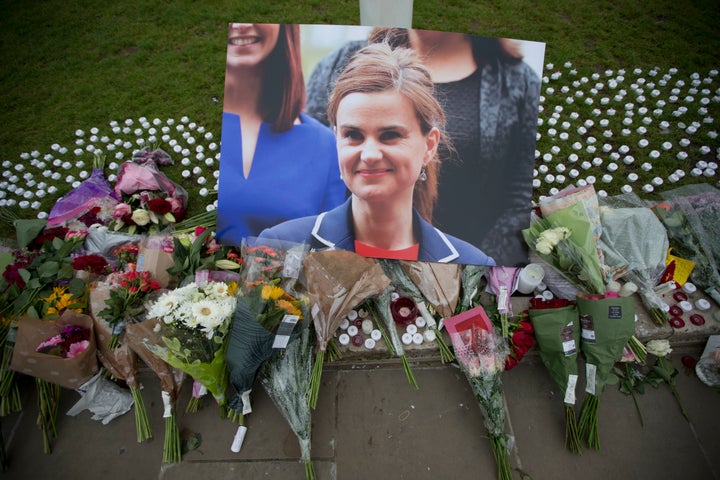 <strong>An image and floral tributes for Jo Cox on Parliament Square on Friday</strong>