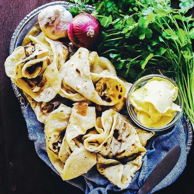 Mauritian Rotis ready to go with a good dollop of butter.