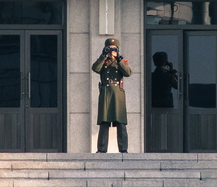 This North Korean soldier has his eyes on a travel deal...probably a one-way ticket